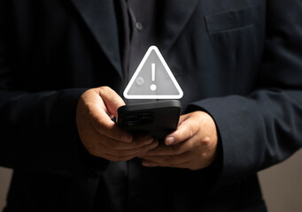 The concept of data theft. Businessmen are warned about the security of using their mobile phones to make transactions. Hackers break into mobile phones to steal personal information online. 