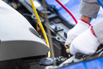 Technician man checks car air conditioning system refrigerant recharge, Repairman with monitor tool to check and fix car air conditioner system, Car Air Conditioning Repair - obrazy, fototapety, plakaty