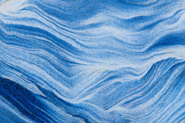 Closeup dust of pigment sparkling with blue fluid color，Abstract mountain background