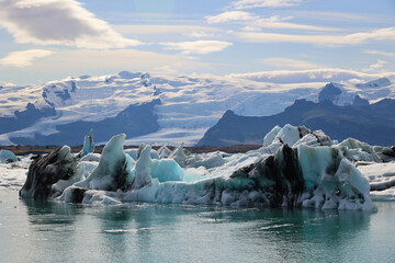 Iceland iceberg in Jökulsárlón glacier lagoon with Vatnajökull National Park in the background