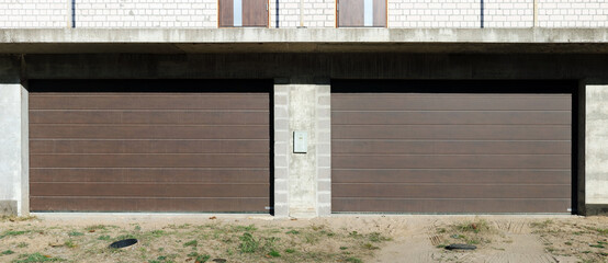 Modern roll up garage doors in the new brick house