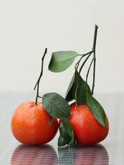 Two ripe tangerines - 701635975