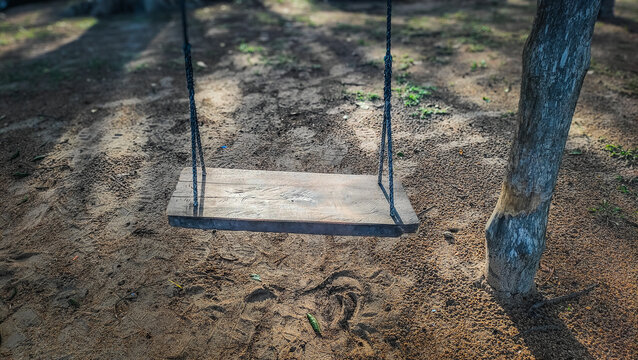 Lonely swing on the beach sand at Pantai Cempaka, Kuantan Pahang, Malaysia.
