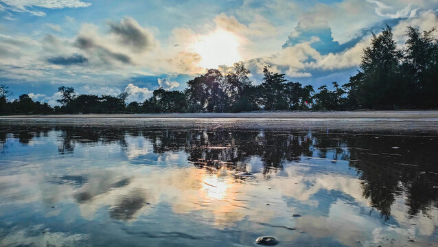 This is sunset at the beach in Pantai Anak Air Kuantan Pahang. This beautiful view was captured in the evening during cloudy day and a reflection of the sunset.