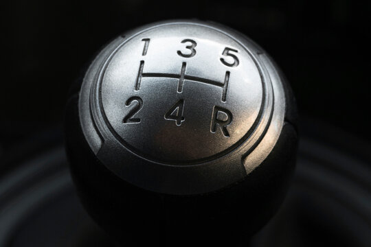 Close up view of a manual gear lever shift. Manual gearbox. Car interior details. Car transmission