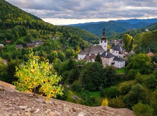 The Spania Dolina village historic buildings in valley of autumn landscape, Slovakia, Europe. - obrazy, fototapety, plakaty