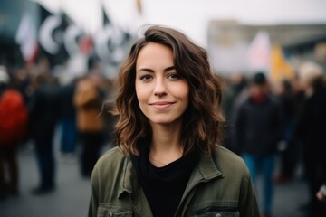 Portrait of a beautiful young woman with a crowd in the background