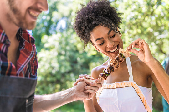 Friends Sharing a Joyful Barbecue Experience