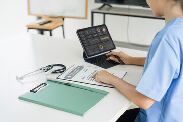 Healthcare professional using modern digital tablet to analyze medical data at hospital. Concept of...