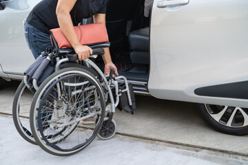 Obraz premium Asian disability woman on wheelchair getting in her car, Accessibility concept.