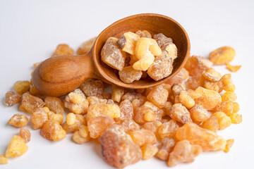 Frankincense or olibanum aromatic resin isolated on white background used in incense and perfumes.