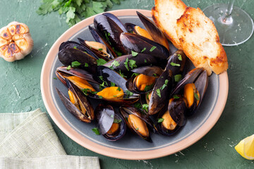 Cooked mussels with oil and parsley. Sea food. Healthy eating. Diet.