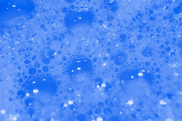 Soap bubbles wallpaper in transparent blue water. defocus not clear details