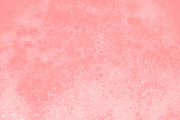 Soap bubbles wallpaper in transparent pink water. defocus not clear details