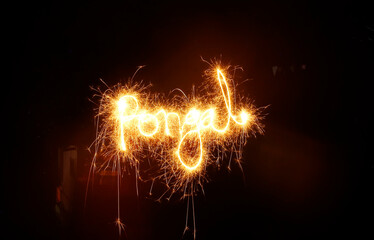 Pongal word sparkler on black background. (fire work)