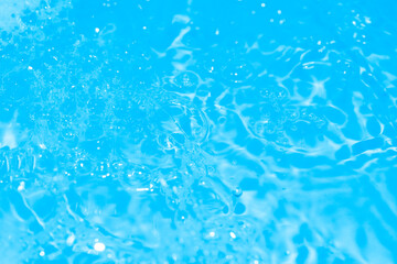 Soap bubbles wallpaper in transparent blue water. defocus not clear details