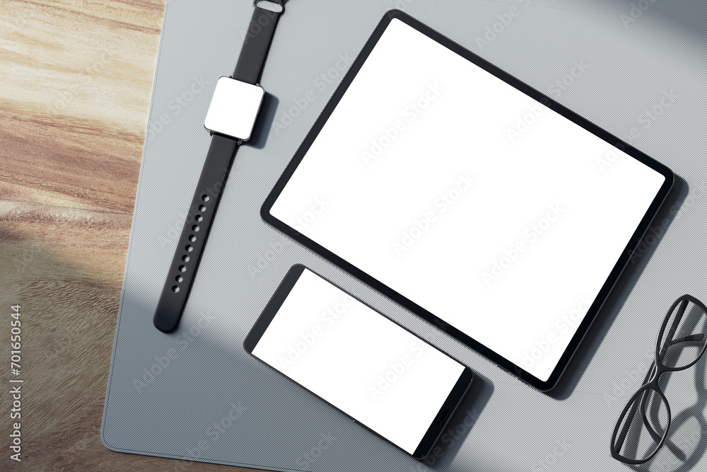 Poster top view of empty white tablet and smartphone screen, digital watch, pen and glasses on wooden table