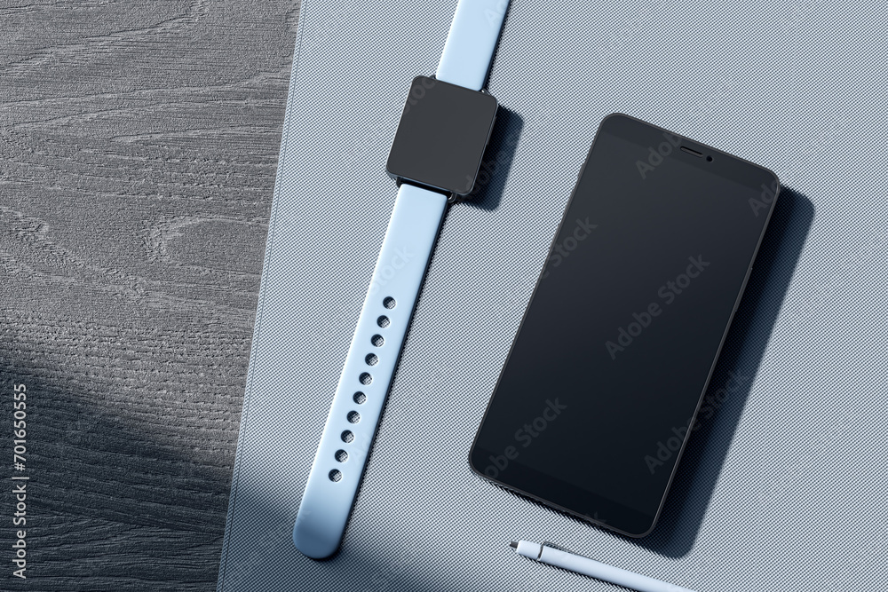 Poster top view of empty mobile phone screen, digital watch, pen and glasses on gray wooden tablet. devices