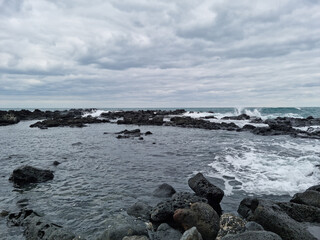 
This is a Jeju Island beach with basalt rocks.