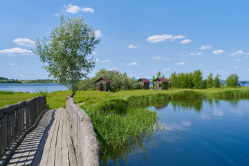 Small camping cabins on the shore by the lake