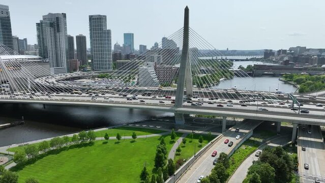 Drone shot of cars driving across the Leonard P. Zakim Bunker Hill Memorial Bridge in Boston, Massachusetts.