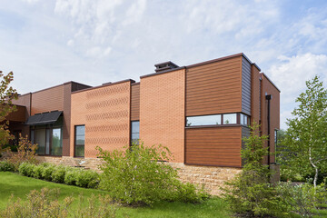 Fototapeta na wymiar Wood and brick exterior of a modern house