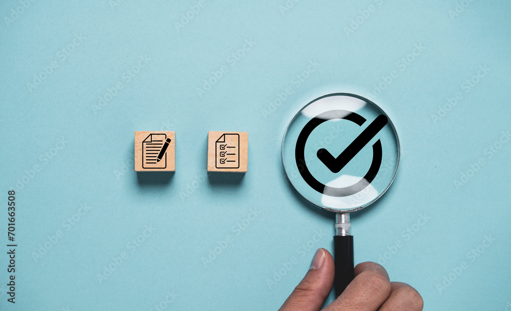 Poster Hand holding magnifier glass with correct sign mark next from document icon for documentation prepare check and approve , Quality control and ISO concept.