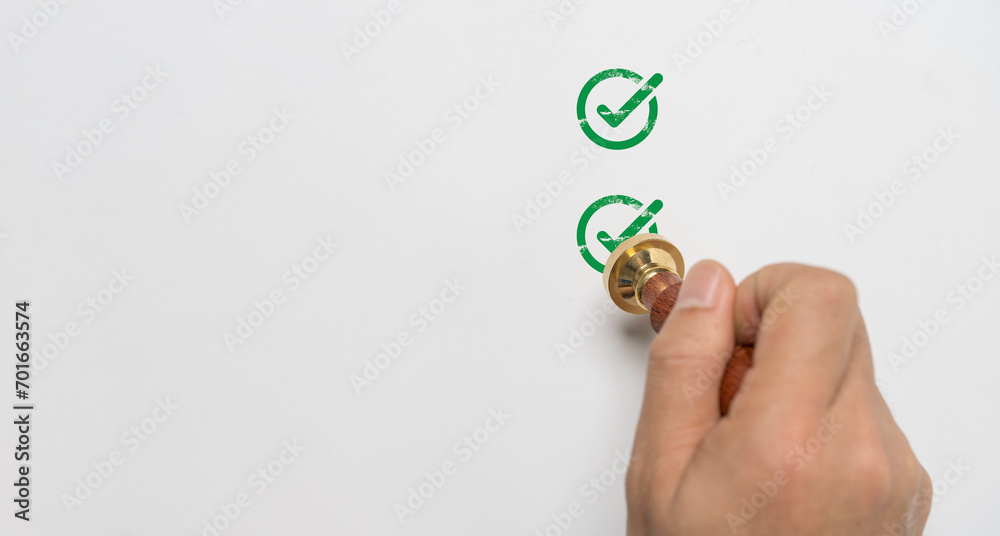 Poster hand stamping green correct sign mark on white paper for document approve and project approval conce