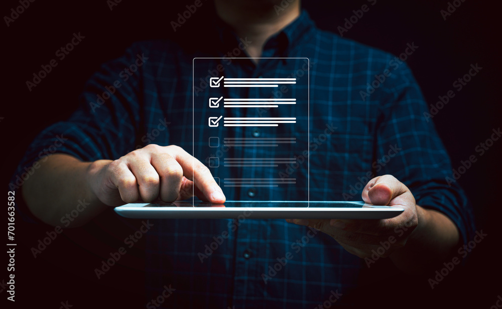 Aufkleber businessman hand touching to tablet with document icon to tick mark for check and approve document ,