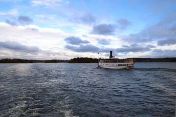big excursion boat driving in the water near Stockholm