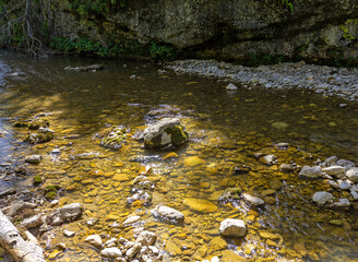 mountainous terrain and a drying stream, a sunny autumn day, walking in the bosom of nature, a panorama of the area.