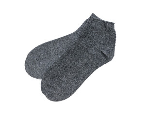 A pair of dark grey socks isolated on a white background.