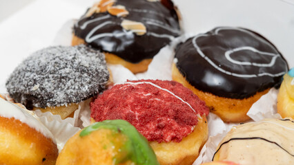 photo of donuts isolated in white background. donuts with a variety of toppings and flavors on top