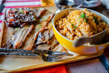 Grilled ribs and prok belly striped served with sauce and java rice - obrazy, fototapety, plakaty