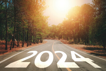2024 written on the road. New year 2024. Business achievement goal and objective target, challenge, goal. Asphalt road with at sunset.