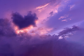 Beautiful of soft and fluffy clouds in sunset shown purple and lilac sky with violet heart and...