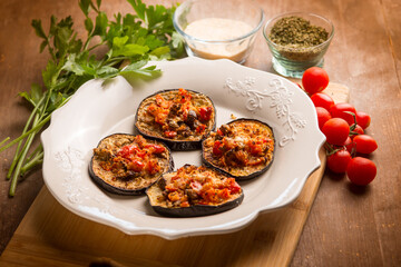oven grated eggplants with fresh tomatoes and cheese
