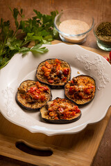 oven grated eggplants with fresh tomatoes and cheese