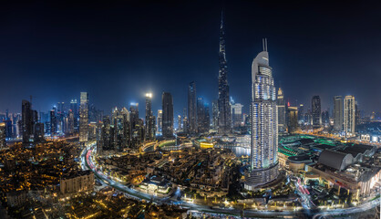 Panoramic view of the illuminated downtown Business Bay district skyline of Dubai, UAE, during...