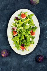 Salad with figs, herbs and cheese.
