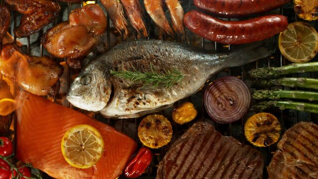 Super slow motion of mix of meats, fish and vegetable on grill grid. Filmed on high speed camera, 1000 fps
