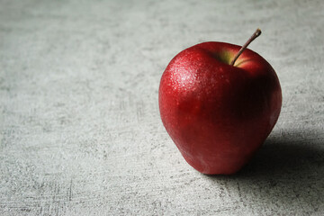 red apple on wooden background