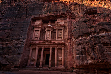 Treasury Al-Khazneh, stone rock historic sight in Petra. Travel Jordan, Arabia holiday. Evening...