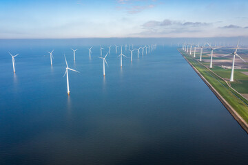 aerial view of wind turbines at the sea coast