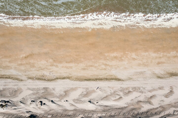 aerial overhead view of sand beach with horizontal stripes