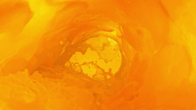 Super Slow Motion of Orange Juice Wave With Slices. Orange Juice With Slices Surf Wave Rotating Around in Creating Tunnel Shape. Filmed on high speed cinema camera, 1000 fps. Speed Ramp Effect.