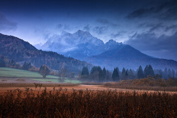 Slovenia landscape. Zelenci lake natural reserve, Kranjska Gora, Slovenia. Foggy Triglav Alps with...