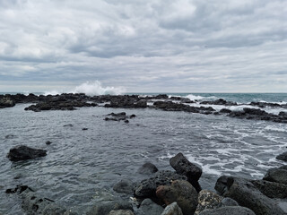
This is a Jeju Island beach with basalt rocks.