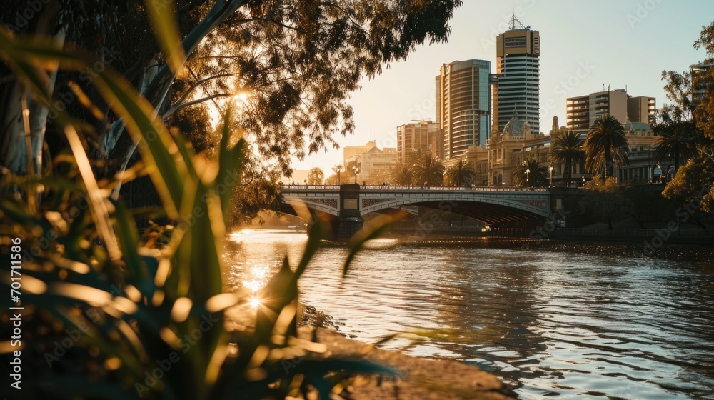 Poster a picturesque bridge spanning over a flowing river with towering buildings in the background. ideal 