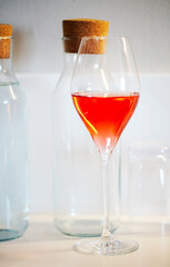 One glass of rose wine on white background